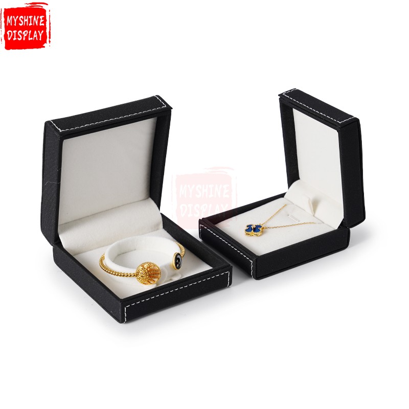 Black leather jewelry packing box with cream velvet inside